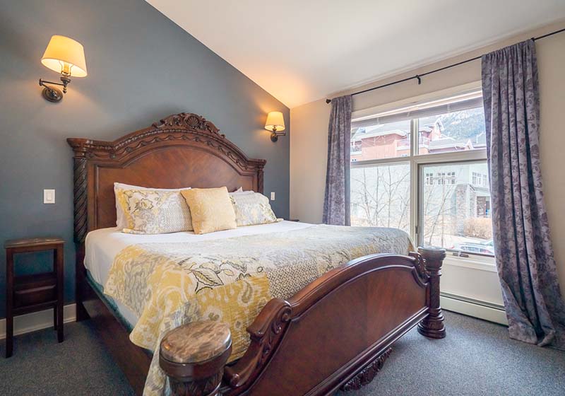 The living room in one of our Regency suites featuring a large, two person clawfoot soaker tub and electric fire place.