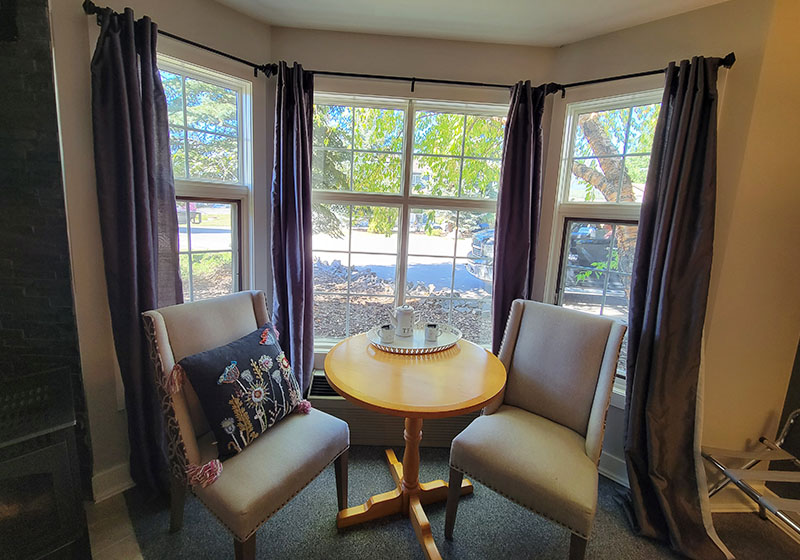 The quaint 2 person sitting area in the Tudor Suite looking out over our courtyard.